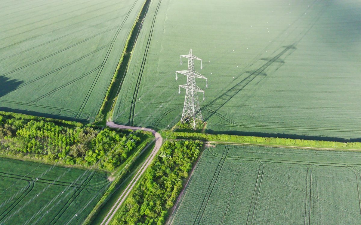 An aerial view of a transmission line crossing farmland