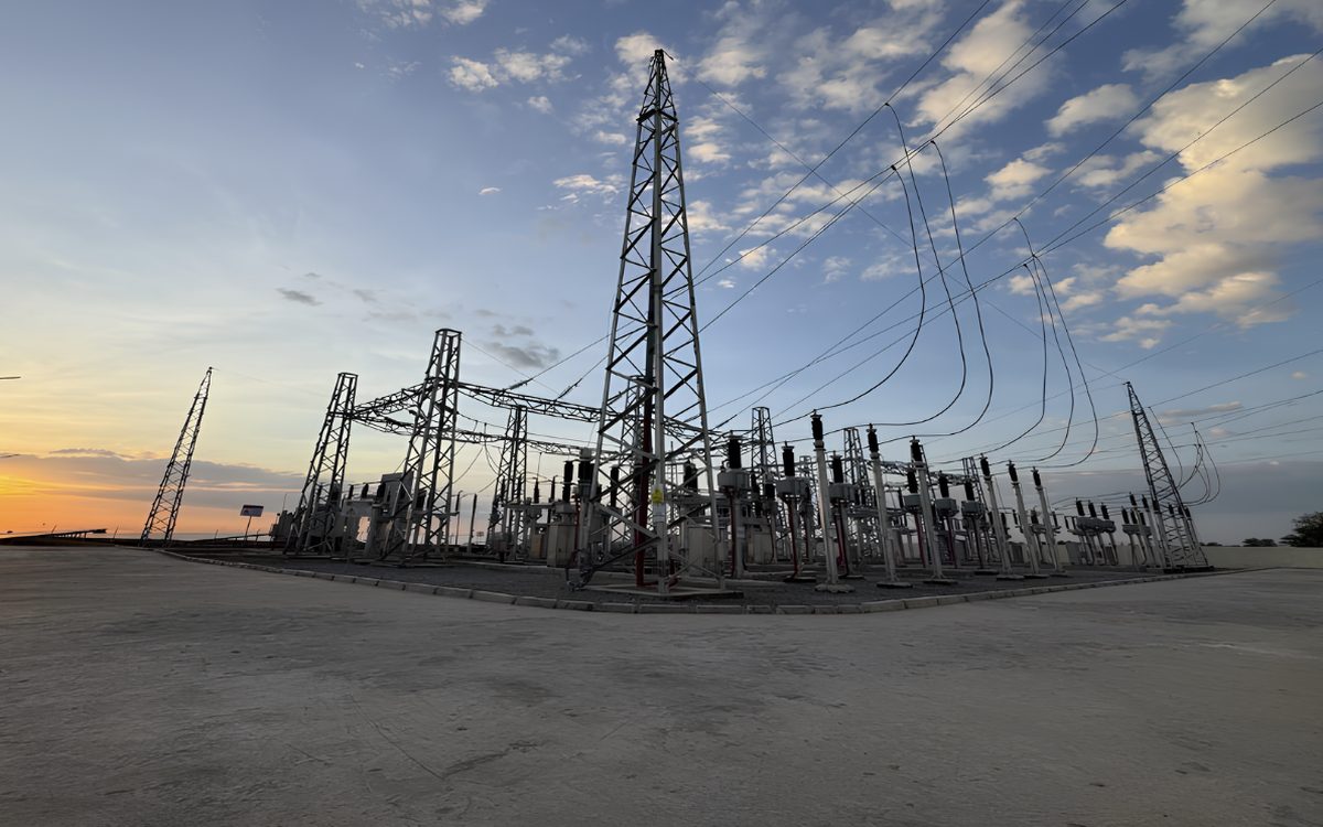 Gantries, busbars and transmission towers at the N'Djamena substation at dusk