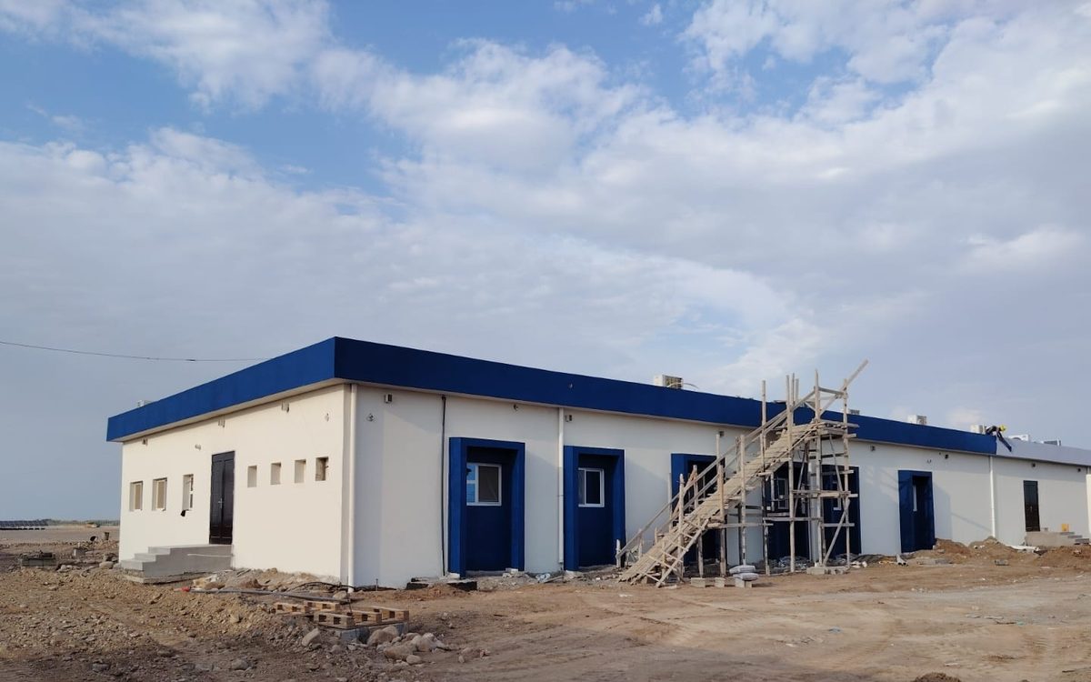 The completed Mocha substation control building with external stairs and switchgear yard