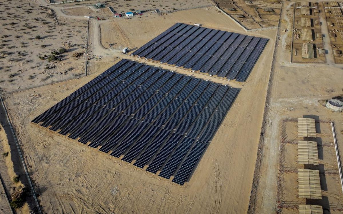 Two array blocks of the Berbera I plant on sandy ground beside the access track
