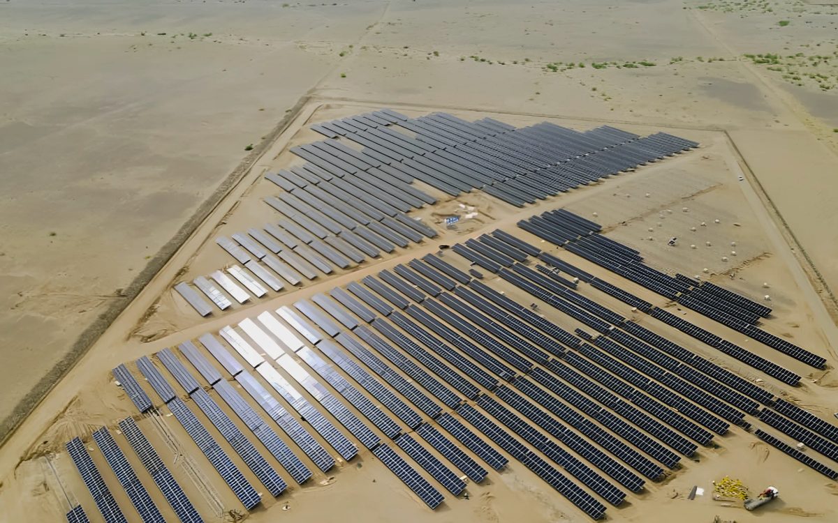 Aerial view of the Khawkha array, its rows fanning across pale desert ground
