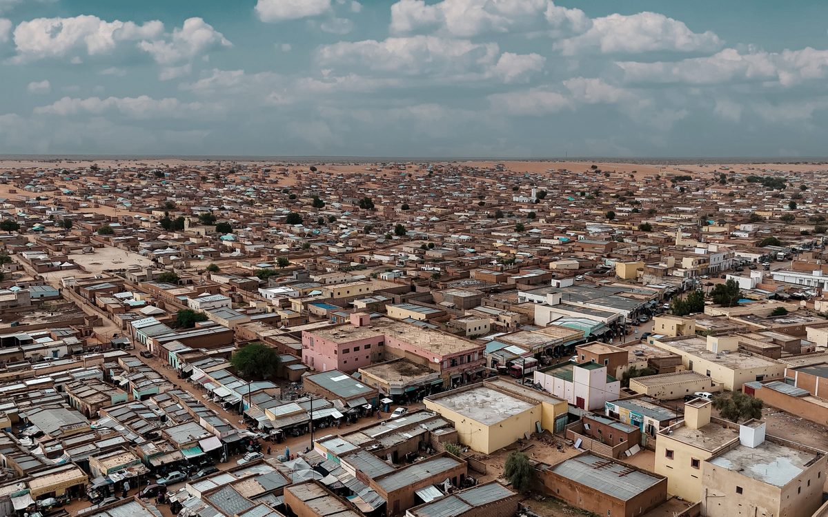 Aerial view over the rooftops of N'Djamena toward the horizon