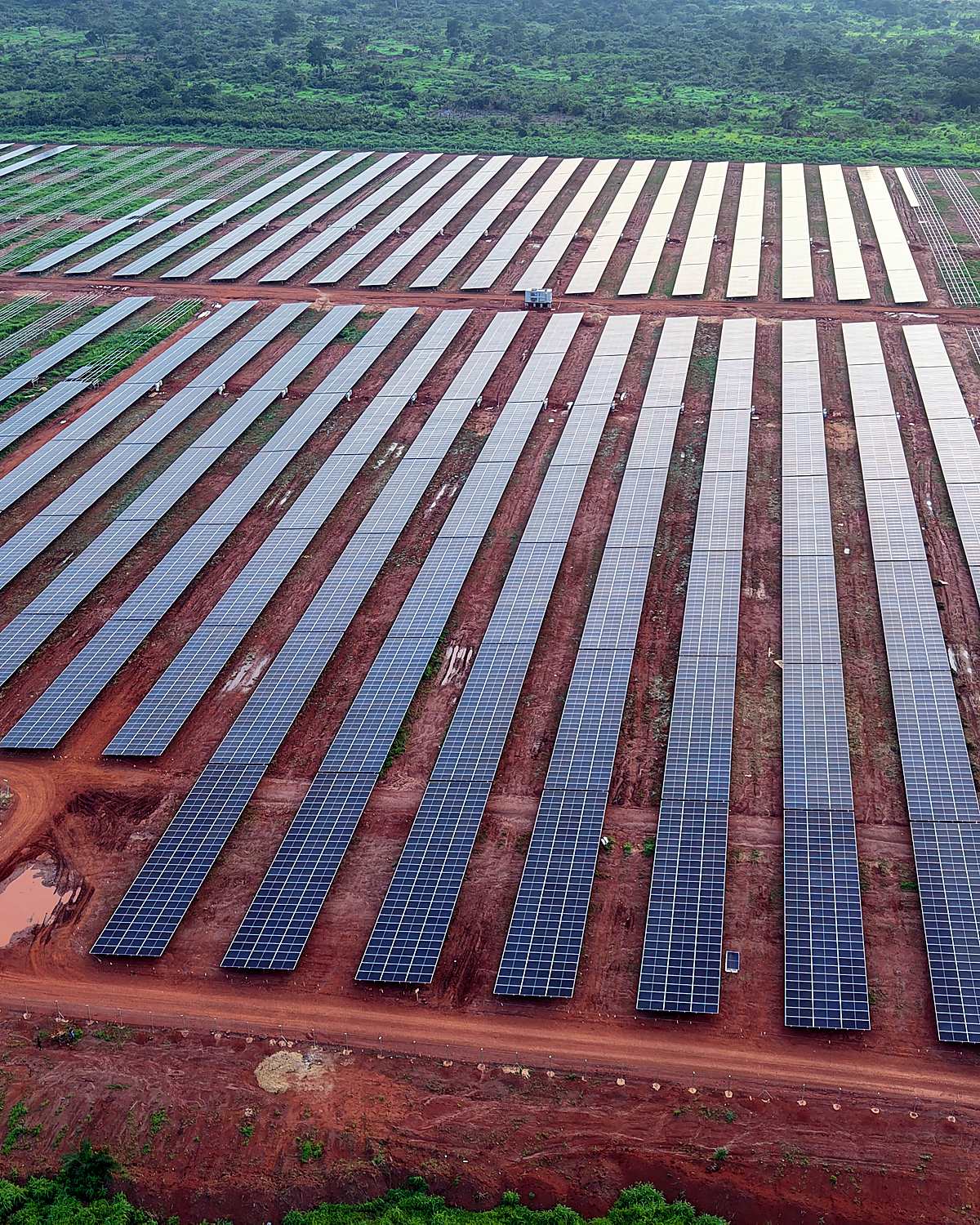 Utility-scale solar arrays across a green landscape, Central African Republic