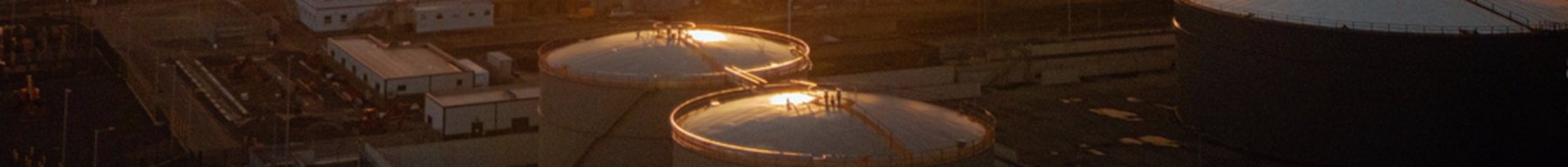 Circular tanks at a desalination plant at night