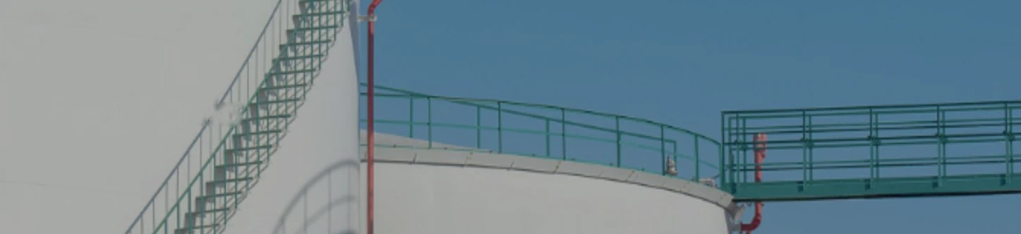 A white fuel storage tank with its stair and walkway