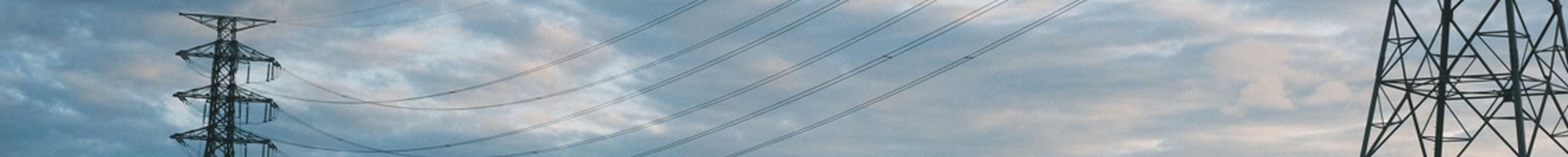 Transmission towers and conductors against an open sky