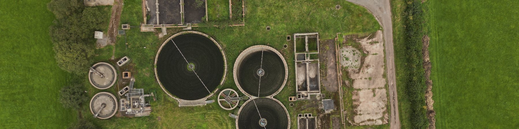 Aerial view of circular clarifier tanks at a treatment works